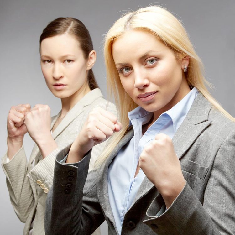 Women in suits ready to strike